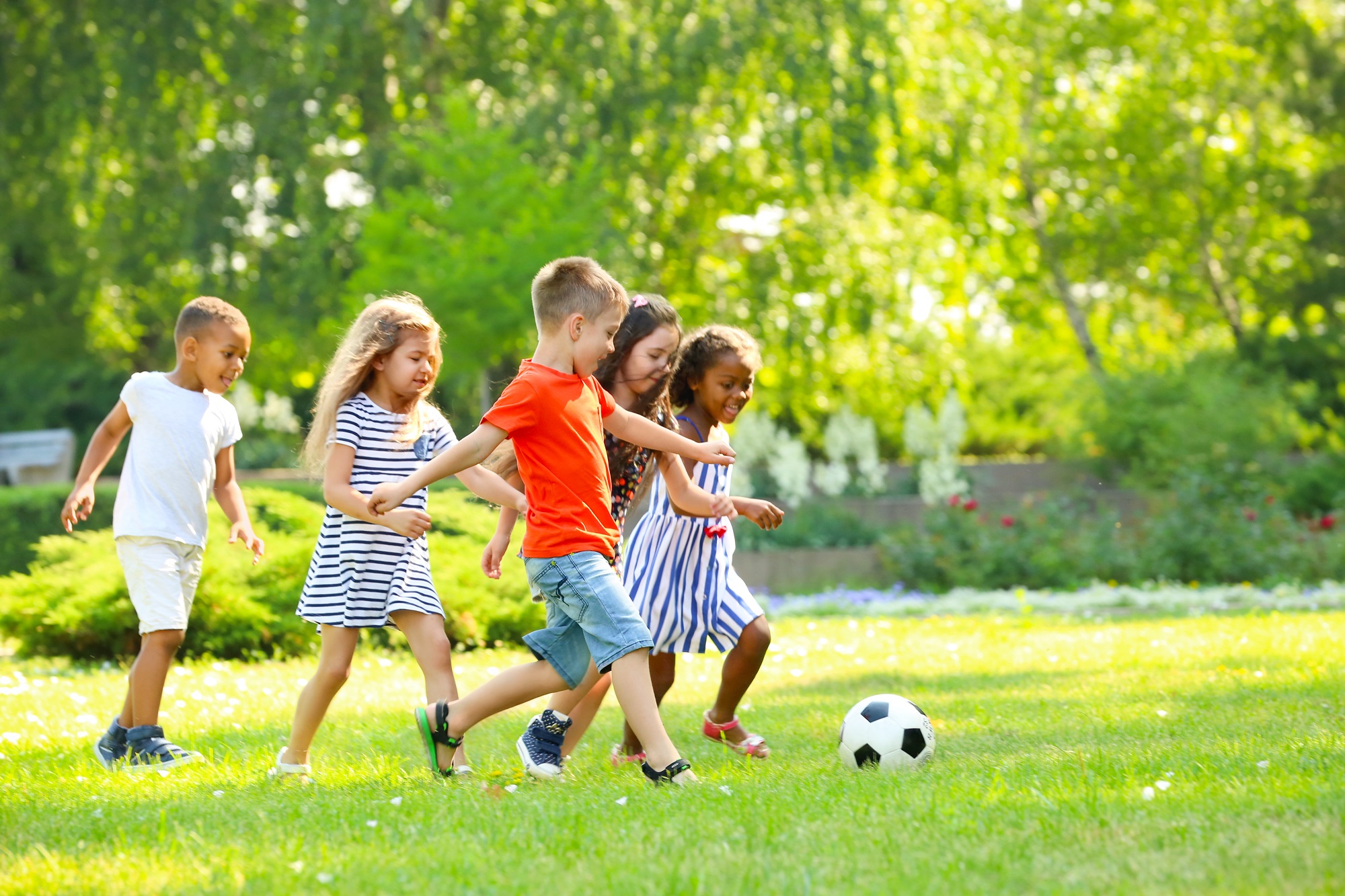 Children playing football outdoors
